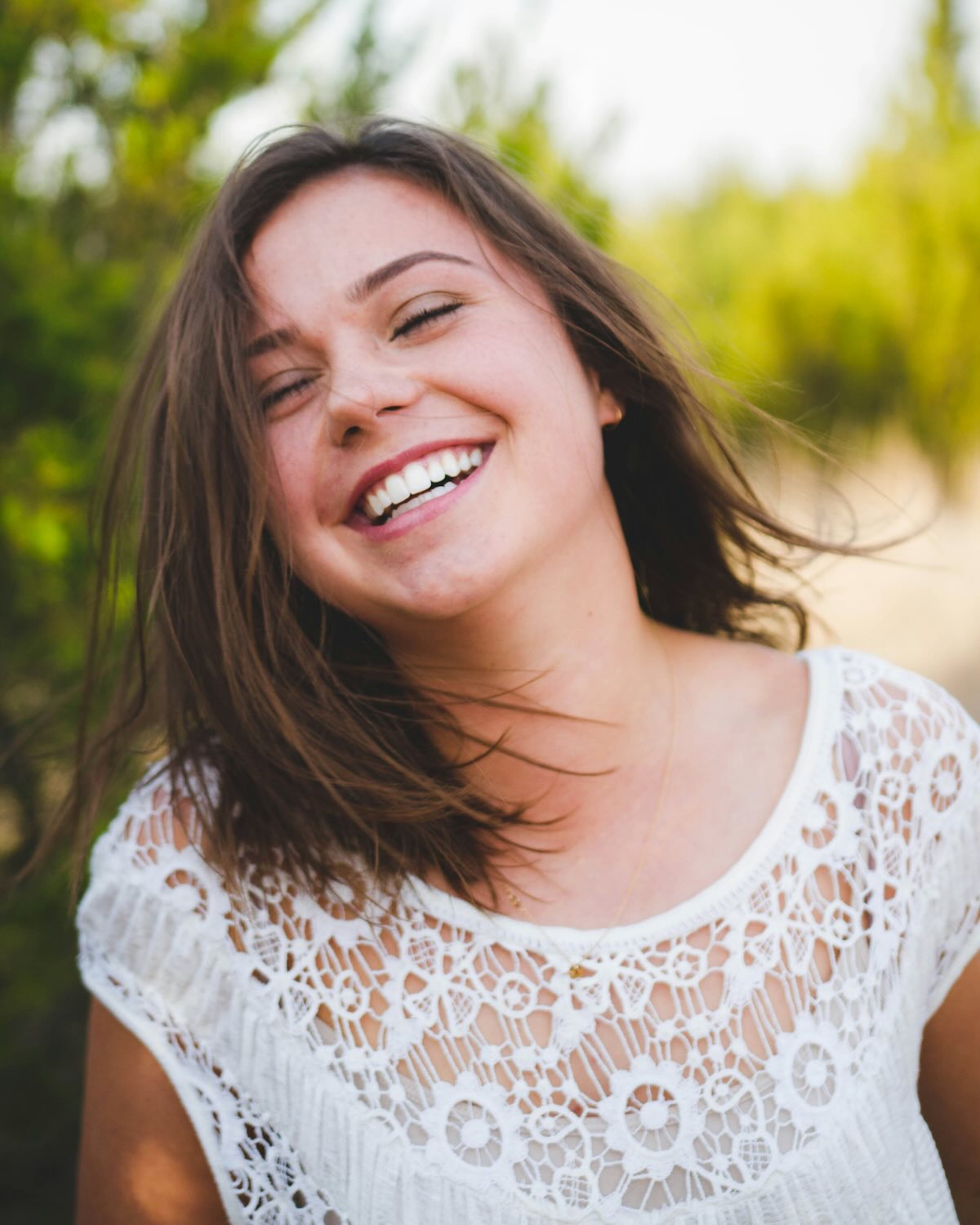 Smiling woman showing her clean teeth